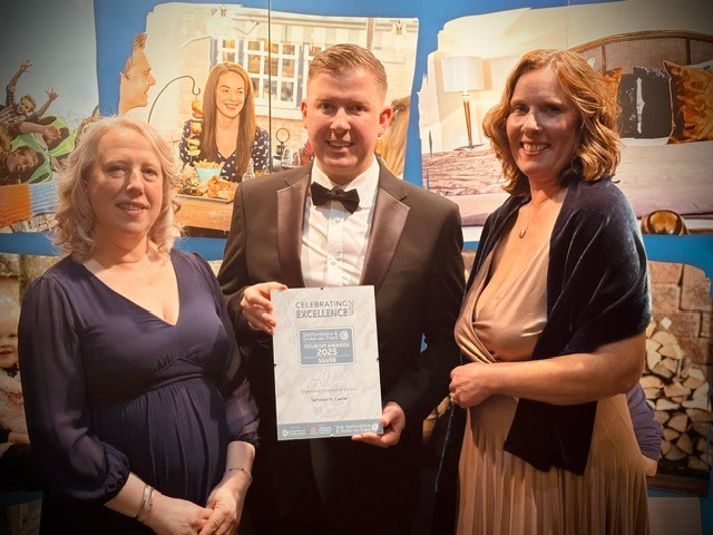 photo of Linda Baker, Tom Dodd and Lara Rowe holding a certificate