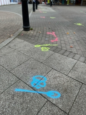 blue, yellow and pink markings on the floor