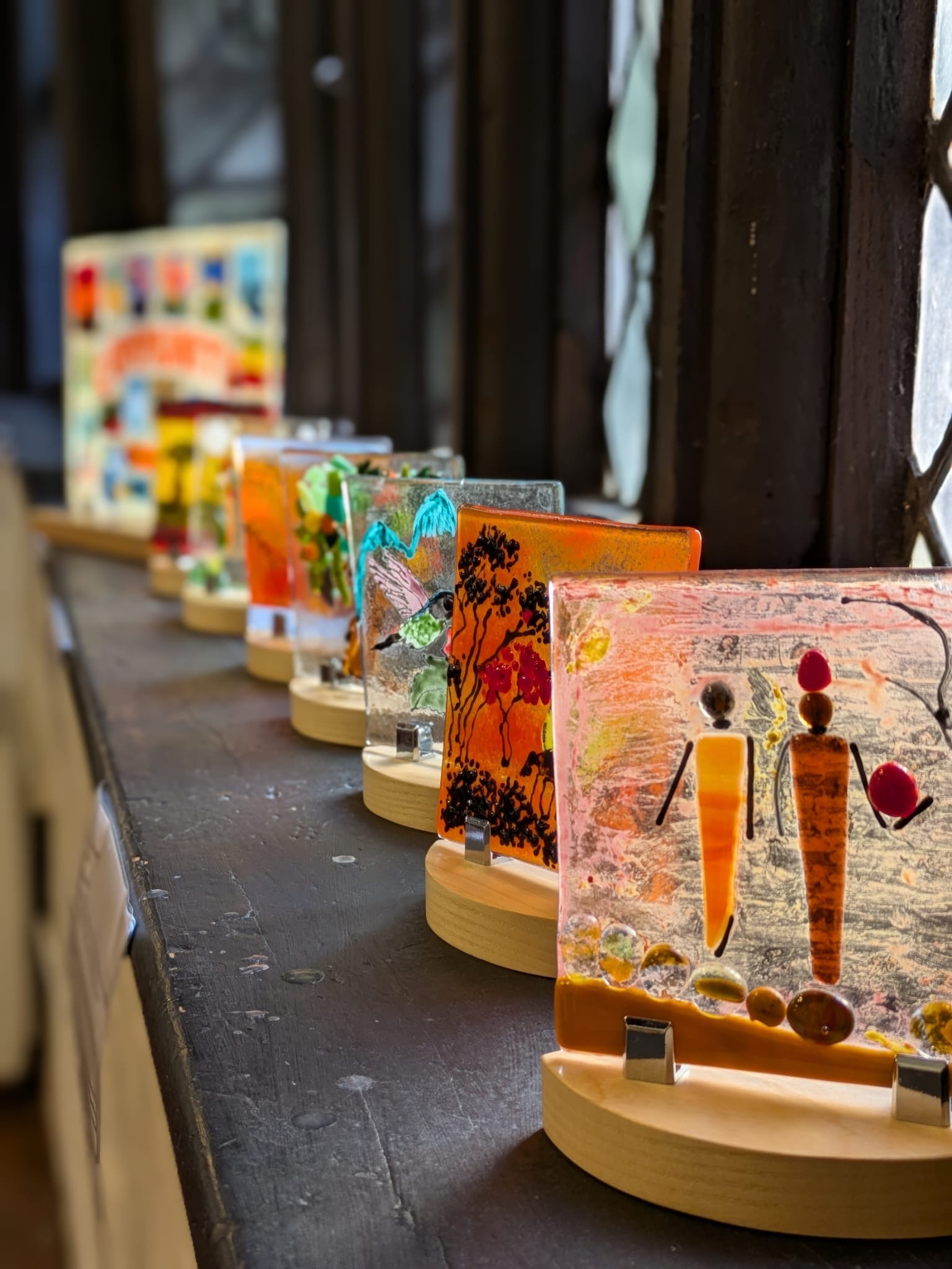 a window displaying various glass artwork 