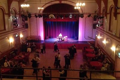 old photo of a dance floor in a theatre auditorium 