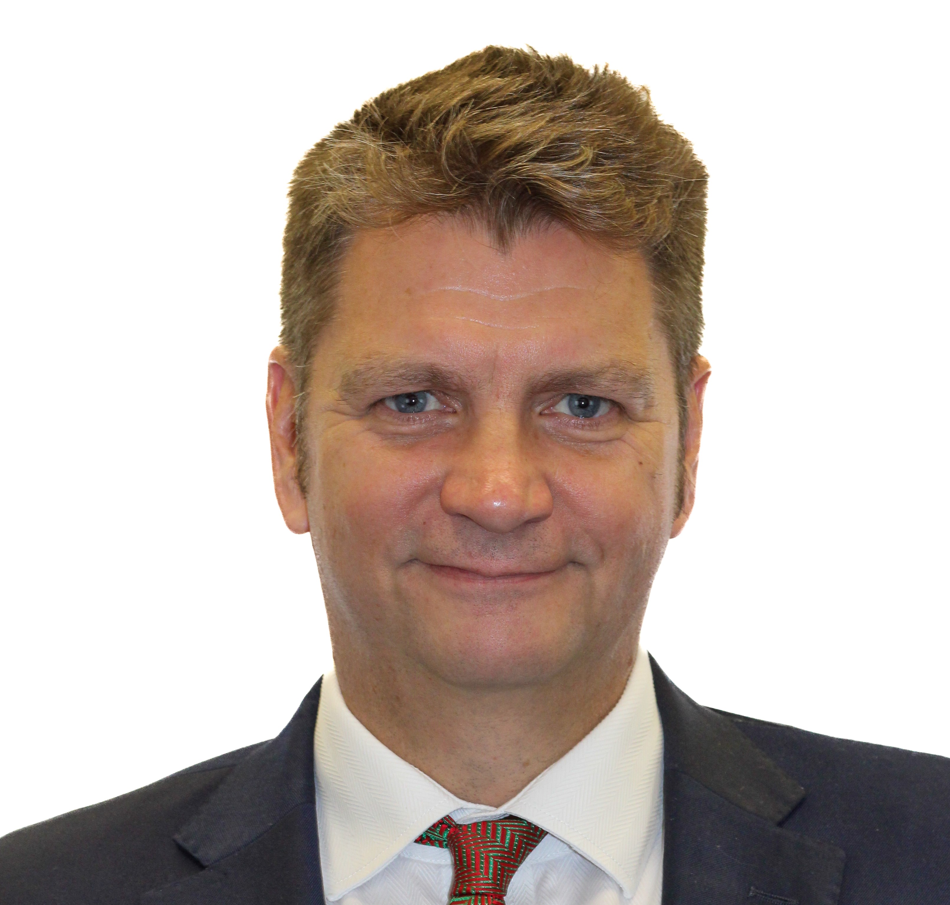 A corporate headshot of a man in a suit