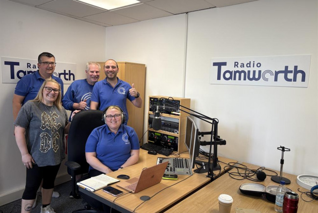 photo of a group of people near a wooden desk