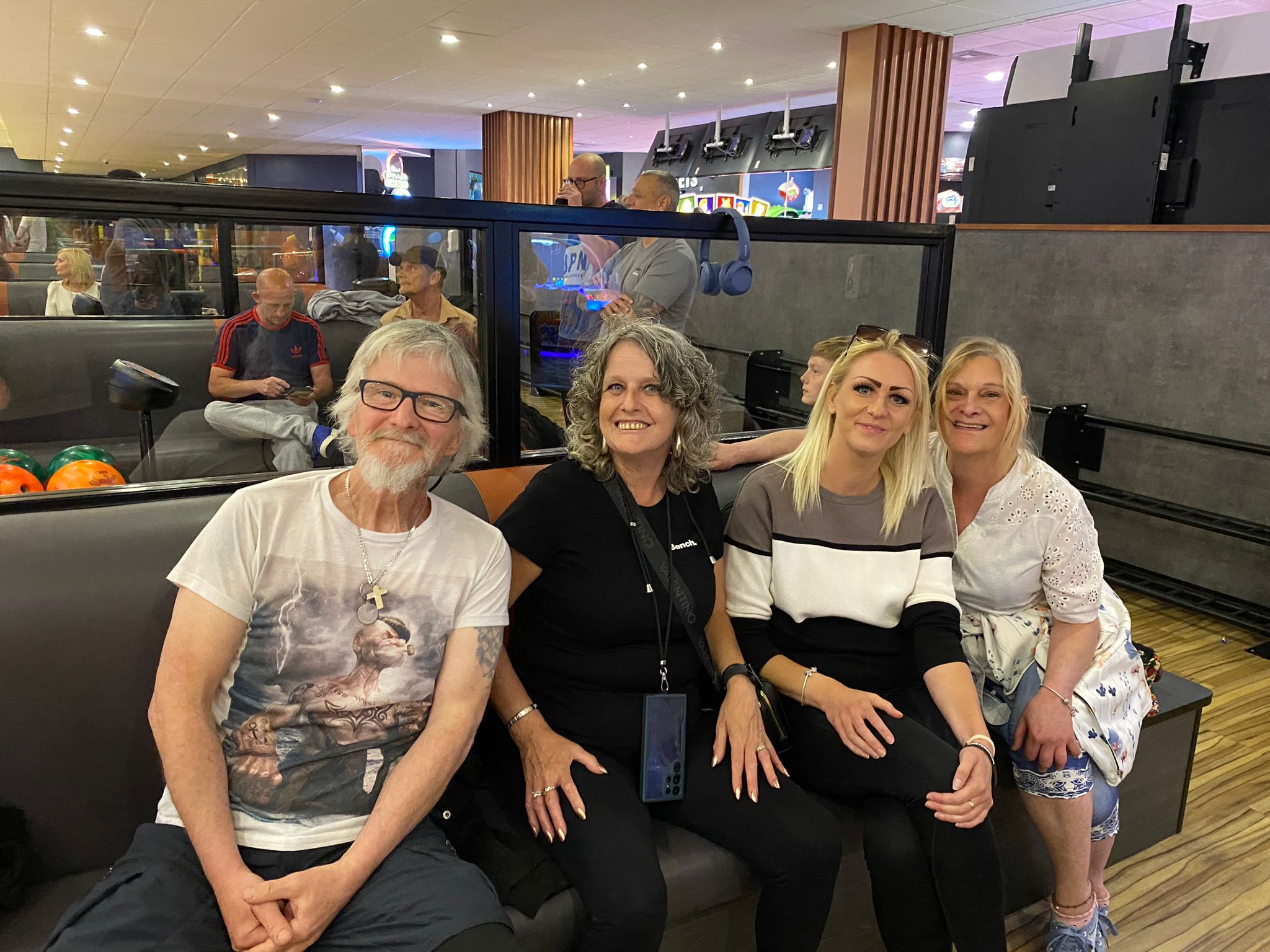 3 people sitting in a venue