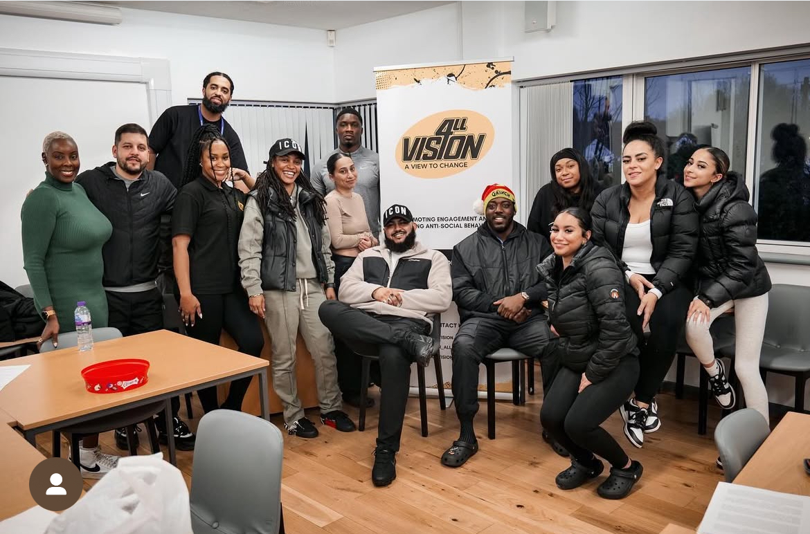 Group photo of a team with roll up banner