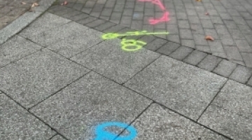 blue, yellow and pink markings on the floor