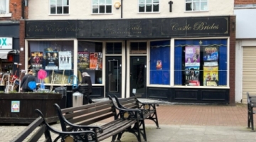 Three benches outside an old building