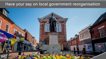 Tamworth Town Hall on a poster stating that local services are changing